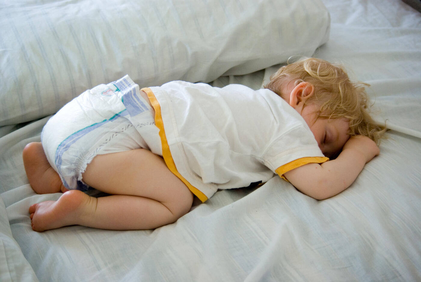 Child sleeping in child's pose