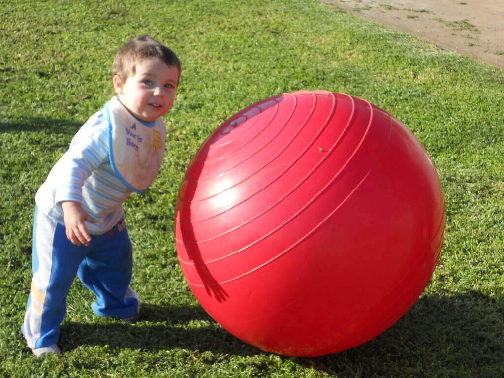 Child with large exercise ball