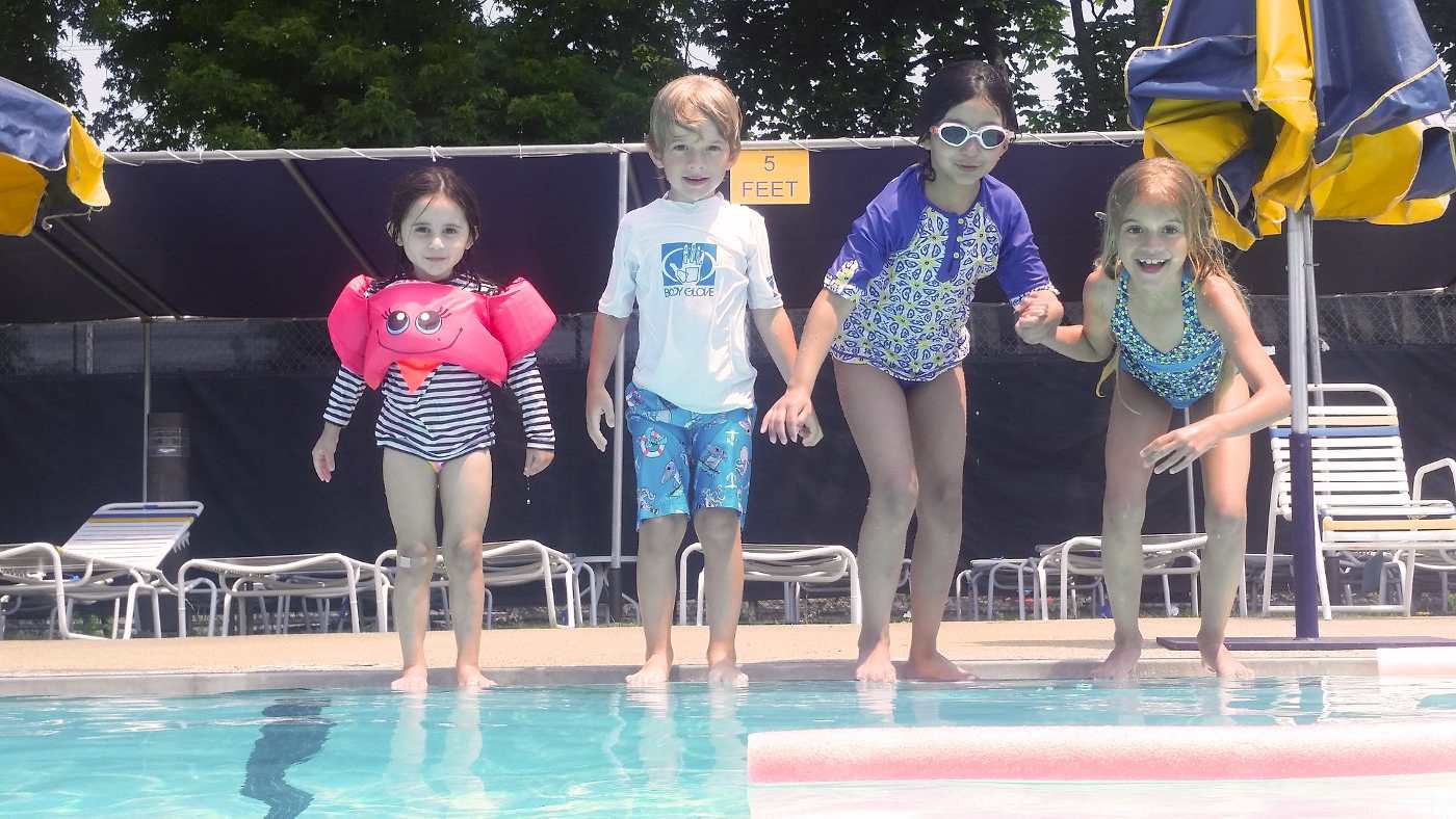 Four kids getting ready to jump in pool - 10 of the Best Pool Diving Games for Kids