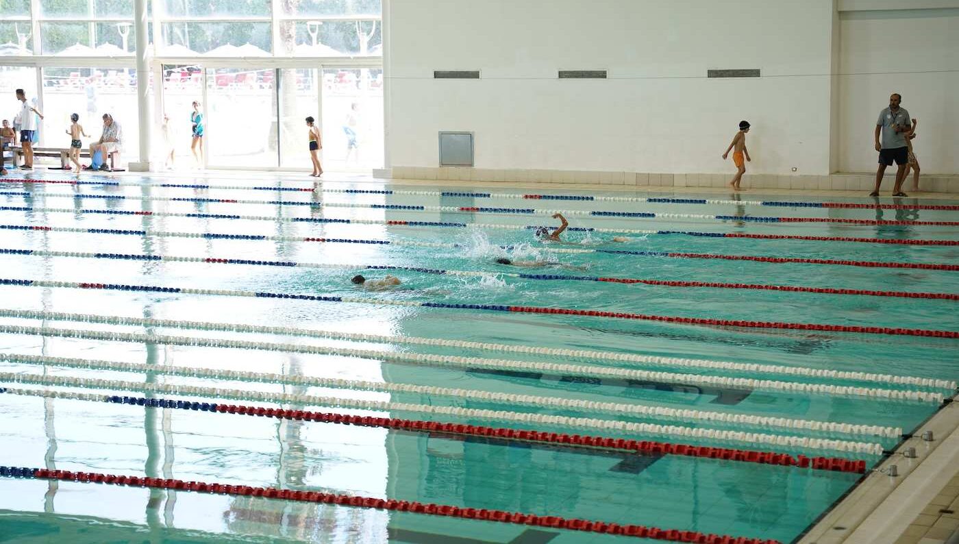 Kids practicing in Olympic-sized indoor pool - Best swimming camp for kids in the United States