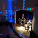 People singing and playing music in talent show - 15 Fun Activities for Youth Groups Indoors