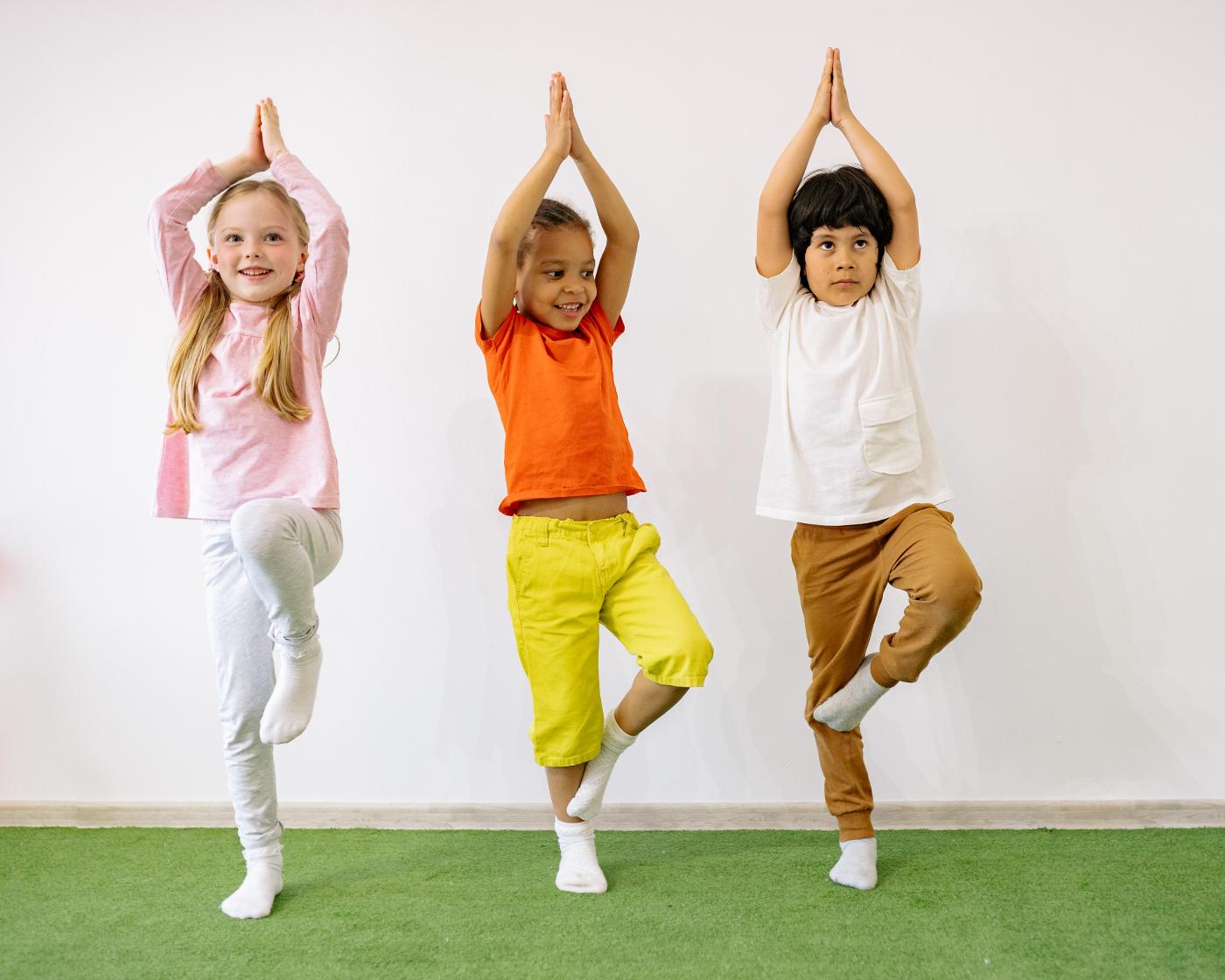 Three young children doing Yoga (tree pose) - Sports for Toddlers: Which Sport Is Best for Your Child?
